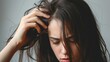 woman very sad and upset looking at damaged hair, hair loss, hair thinning problem, vitamin deficiency, baldness, postpartum, biotin, zinc, menstrual or endocrine disorders, hormonal imbalance
