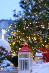 Wall Mural - Christmas Lantern in snowy decorated garden, festive landscape. Winter nature background. christmas holiday. magic festive winter still life.