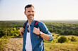 © baranq - Smiling mid adult man hiking