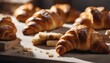 Freshly Baked Croissants, a batch of buttery, flaky croissants, their golden-brown crusts glowing
