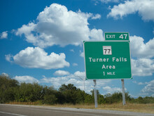 Roadside Sign Along Interstate 35 Showing Turner Falls Exit At The Arbuckle Mountains, Oklahoma.