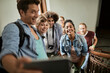 © Marko Geber - Group of friends taking a selfie on a staircase while on a vacation