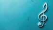 White treble clef symbol on a teal textured wall