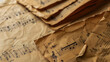 Worn pages of classical sheet music with prominent musical notation