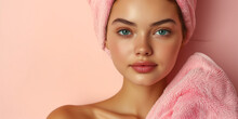 Girl with a pink towel wrapped around her head against pink background. Image for a facial spa or wellness center, skincare brand. Banner with copy space.