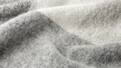 Wall Mural - Alpaca wool mix soft warm scarf, pattern background. Trendy cream grey color wool texture