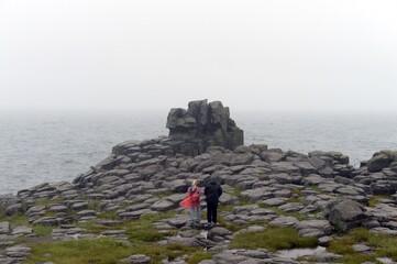 Tourists on the cliff of the Bruce Peninsula in Peter the Great Bay. Primorsky Krai