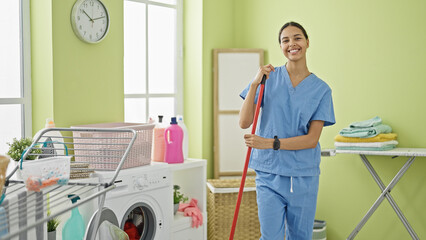 Sticker - African american woman professional cleaner smiling at laundry room