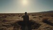 person in a desolate landscape, and the scene is set in a barren, sunlit desert. The opening shot shows black man burying himself in a shallow grave, setting a mysterious and somewhat eerie tone