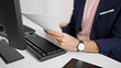 © Krakenimages.com - Young hispanic man business worker using computer holding documents at office
