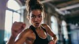 Woman practicing bodycombat in a gym