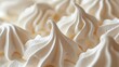 Macro shot of soft, white meringue swirls with selective focus