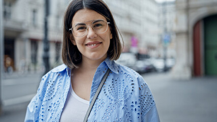 Poster - Young beautiful hispanic woman smiling confident standing in the streets of Vienna