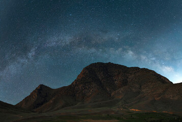 Wall Mural - beautiful night landscape. mountains landscape under beautiful bright milky way galaxy.