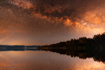 Wall Mural - beautiful night landscape, bright milky way galaxy on the lake.