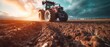 A farmer in a tractors and harvester working in the field to prepares the ground . Agriculture concept suitable for production. A tractor on a soybean farm in the spring sunset. generative ai