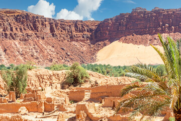 Wall Mural - Al Ula ruined old town streets with palms and mountain in the background, Saudi Arabia