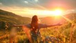 © buraratn - Carefree Happy Woman Enjoying Nature on grass meadow on top of mountain cliff with sunrise.