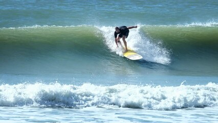 Poster - Surfer rides the wave in Brazil