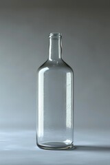 Poster - A glass bottle sitting on top of a table. Perfect for various uses