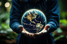 Embracing The World: A Person Discovering The Beauty Of Our Planet Through A Small Globe