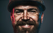© Svitlana - Closeup portrait smiling handsome engineer, architect or builder in safety helmet. Mechanical, industrial or construction worker with dirty face in hard hat. Smiling bearded man in protective hardhat.