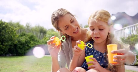 Sticker - Mother, daughter and bubbles in garden for fun together outdoor, parent and young child with game and toys. Liquid soap, woman and girl happy in backyard at home, playful and smile with bonding