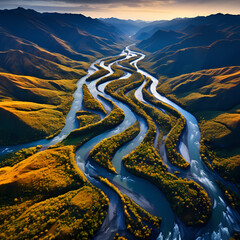  Aerial view of a winding river through mountains.