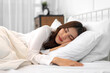 © Art_Photo - Portrait of cheerful beautiful pretty asian woman clean fresh healthy white skin sleeping and close eye.Girl felling relaxing and enjoy time on the bed at home.asia beauty