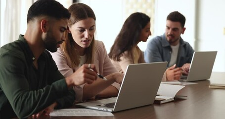 Canvas Print - Male mentor helping to female apprentice, teach intern, training new worker, provide explanation, developing project growth strategy, brainstorm together fresh ideas, engaged in teamwork using laptop