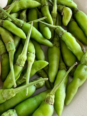 Wall Mural - fresh green chili in white bowl