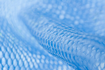 Close up shot of blue nylon mesh fabric.