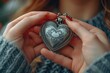 © create - Close-up of hands exchanging heart-shaped lockets as a symbol of love