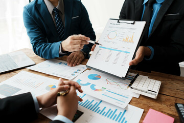 Aufkleber - business people or accountant using calculator while working analytical business report on the workplace, accounting concept, Serious and focused financier accountant on paper work inside office,