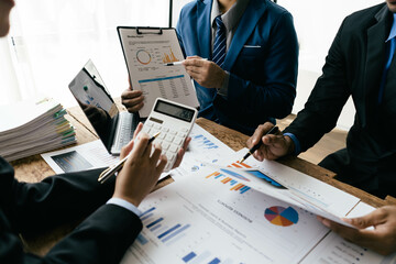 Aufkleber - business people or accountant using calculator while working analytical business report on the workplace, accounting concept, Serious and focused financier accountant on paper work inside office,