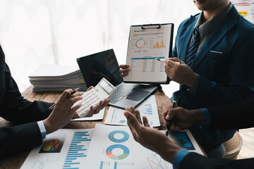 Aufkleber - business people or accountant using calculator while working analytical business report on the workplace, accounting concept, Serious and focused financier accountant on paper work inside office,