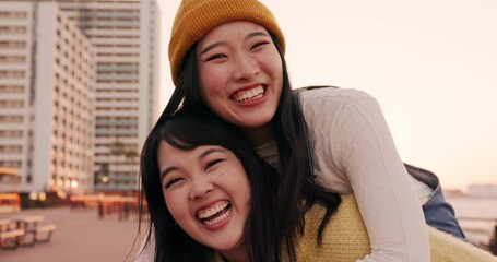 Sticker - Friends, women and piggyback outdoor on promenade with bonding, laughing and adventure on holiday or vacation. Travel, Japanese people or embrace at beach in city with fun, comedy or freedom together