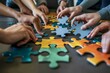 © Adobe Contributor - A group of people of different ethnicities are putting together a puzzle.
