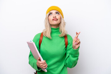 Wall Mural - Young Russian student woman isolated on white background with fingers crossing and wishing the best