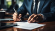 © sommersby - Executive Signing Important Documents at a Glossy Office Desk