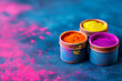 Close-up of Holi color powders in three pots on vibrant backdrop. Concept of cultural joy and festival tradition.
