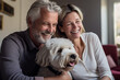 © luismolinero - Middle aged couple at indoors with a dog