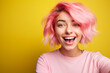 © luismolinero - Young pink haired woman over isolated colorful background making a selfie