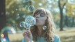 © Emil - Girl blowing bubble with wand in park