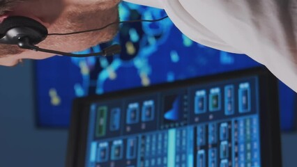 Wall Mural - Workplace of the air traffic controllers in the control tower. Team of professional aircraft control officers works using radar, computer navigation and digital maps.