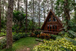 Triangular house built from wood in the forest in the rainy season