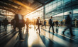 © JQM - Blurred motion of people moving in the lobby of a corporate building, serving as background material for corporate websites