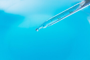 Wall Mural - blue macro science experiment beaker,chemical test tube . chemical experiment with laboratory glass.