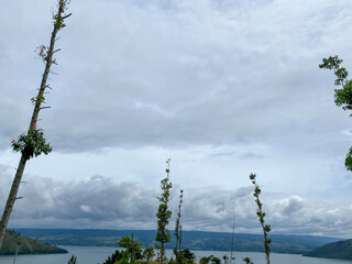 Wall Mural - Cloudy Sky Against The Lake. Lake Toba taken from Sibea-bea hills, North Sumatra.