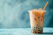 A cup of bubble boba milk tea on blue background. Banner for restaurant